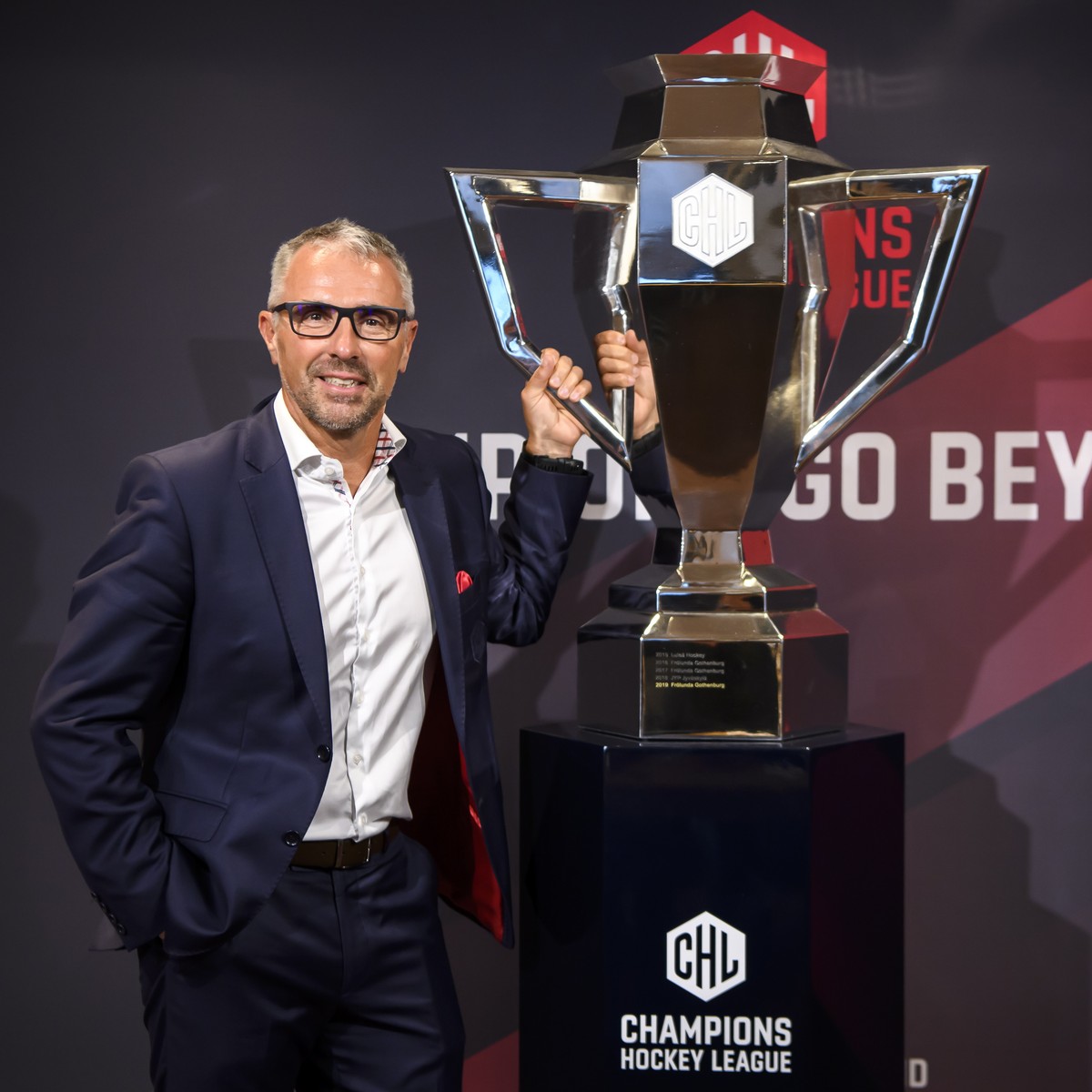 epa07780918 Champions Hockey League (CHL) CEO Martin Baumann poses next to the CHL Cup during a press conference about the current developments of the Champions Hockey League in Bern, Switzerland, 19  ...
