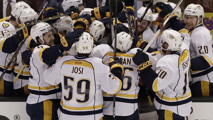 Nashville Predators players celebrate a goal by Austin Watson against the Anaheim Ducks during the third period of Game 5 in the NHL hockey Stanley Cup Western Conference finals in Anaheim, Calif., Sa ...