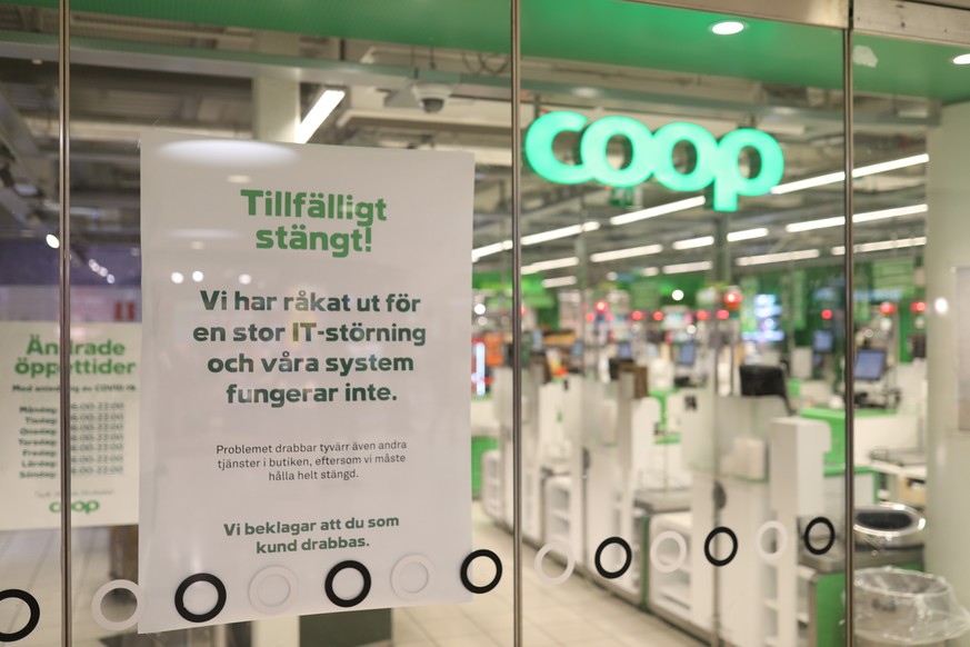 FILE - In this July 3, 2021 file photo, a sign reads: &quot; Temporarily Closed. We have an IT-disturbance and our systems are not functioning&quot;, posted in the window of a closed Coop supermarket  ...