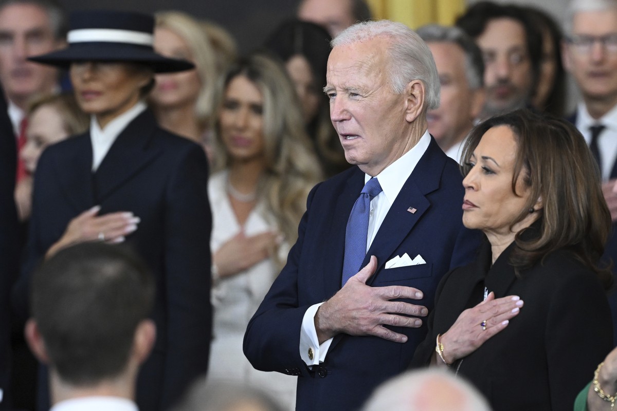 Former President Joe Biden and former Vice President Kamala Harris stand as Christopher Macchio performs "The Star-Spangled Banner" after President Donald Trump was sworn in during the 60th  ...