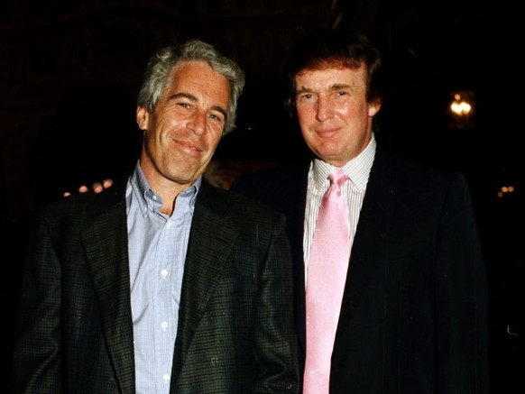 Portrait of American financier Jeffrey Epstein (left) and real estate developer Donald Trump as they pose together at the Mar-a-Lago estate, Palm Beach, Florida, 1997. (Photo by Davidoff Studios/Getty ...