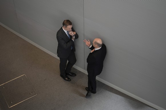 German Chancellor Olaf Scholz, right, talks to German Finance Minister Christian Lindner, left, during a debate at the German parliament Bundestag in Berlin, Germany, Wednesday, March 20, 2024, ahead  ...