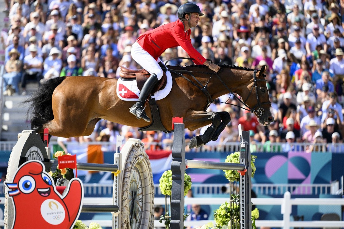 Steve Guerdat of Switzerland riding Dynamix De Belheme competes during the equestrian individual finals at the 2024 Paris Summer Olympics in Paris, France, Tuesday, August 6, 2024. (KEYSTONE/Laurent G ...