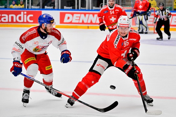Czechia's Ondrej Beranek, and Switzerland's Tyler Moy in action during the Beijer Hockey Games match in the Euro Hockey Tour (EHT) between Switzerland and the Czech Republic, at Catena Arena ...