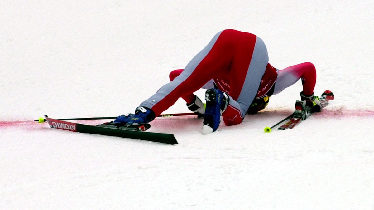 Austria's Hermann Maier kisses the red line after winning a mens ski World Cup giant slalom race at Val d'Isere, France, Sunday, Dec. 10, 2000. The reigning world champion in 1997 was stripp ...