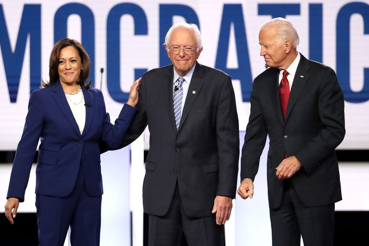 WESTERVILLE, OHIO - OCTOBER 15: Sen. Kamala Harris (D-CA), Sen. Bernie Sanders (I-VT), and former Vice President Joe Biden enter the stage before the Democratic Presidential Debate at Otterbein Univer ...