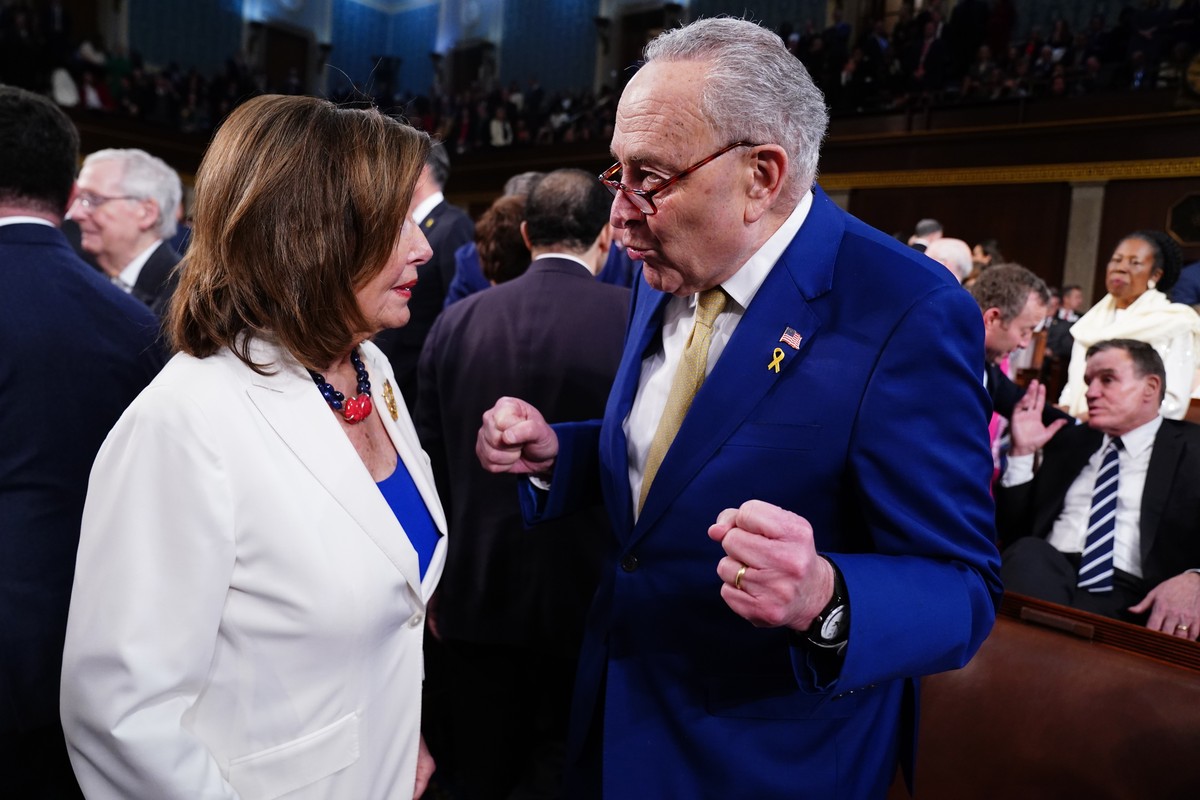 epa11205632 Senate Majority Leader Chuck Schumer (R) chats with Democratic Representative from California Nancy Pelosi (L) in the House of Representatives ahead of US President Joe Biden's third  ...
