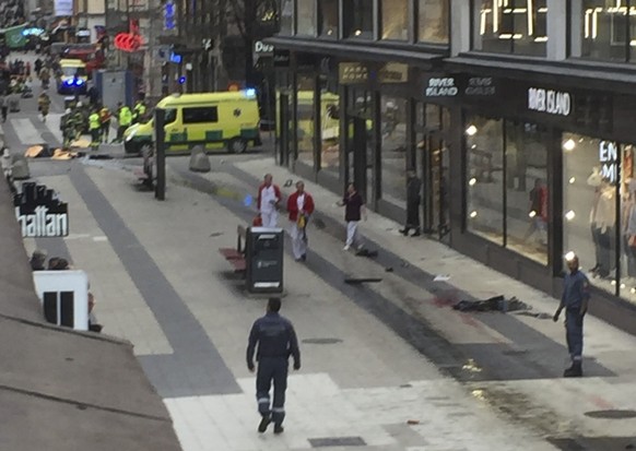 epa05894580 A view of a street after a truck reportedly crashed into a department store in central Stockholm, Sweden, 07 April 2017. A truck has driven into crowds on a street in central Stockholm, media reported quoting local police. According to initial reports, at least three people were killed in the incident, media added.  EPA/ANDREAS SCHYMAN  SWEDEN OUT