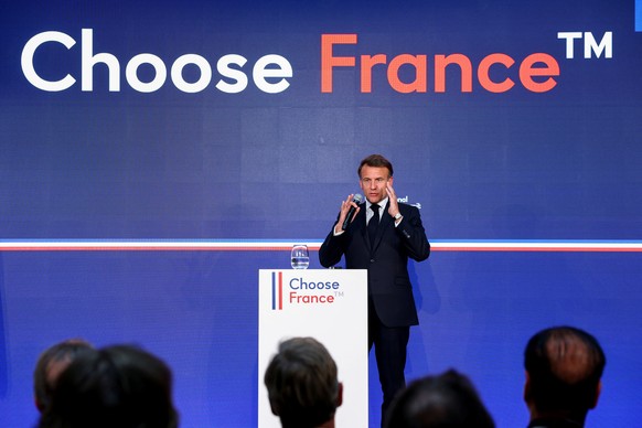 epa12117530 French President Emmanuel Macron speaks at the &#039;Choose France Summit&#039;, aiming to attract foreign investors to the country, at the Chateau de Versailles, near Paris, France, 19 Ma ...