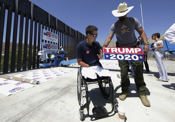 FILE - In this May 30, 2019 file photo We Build the Wall Founder Brian Kolfage, left, and David Clarke Jr., a board member of the group, prepare for a news conference in Sunland Park, N.M. Former Whit ...