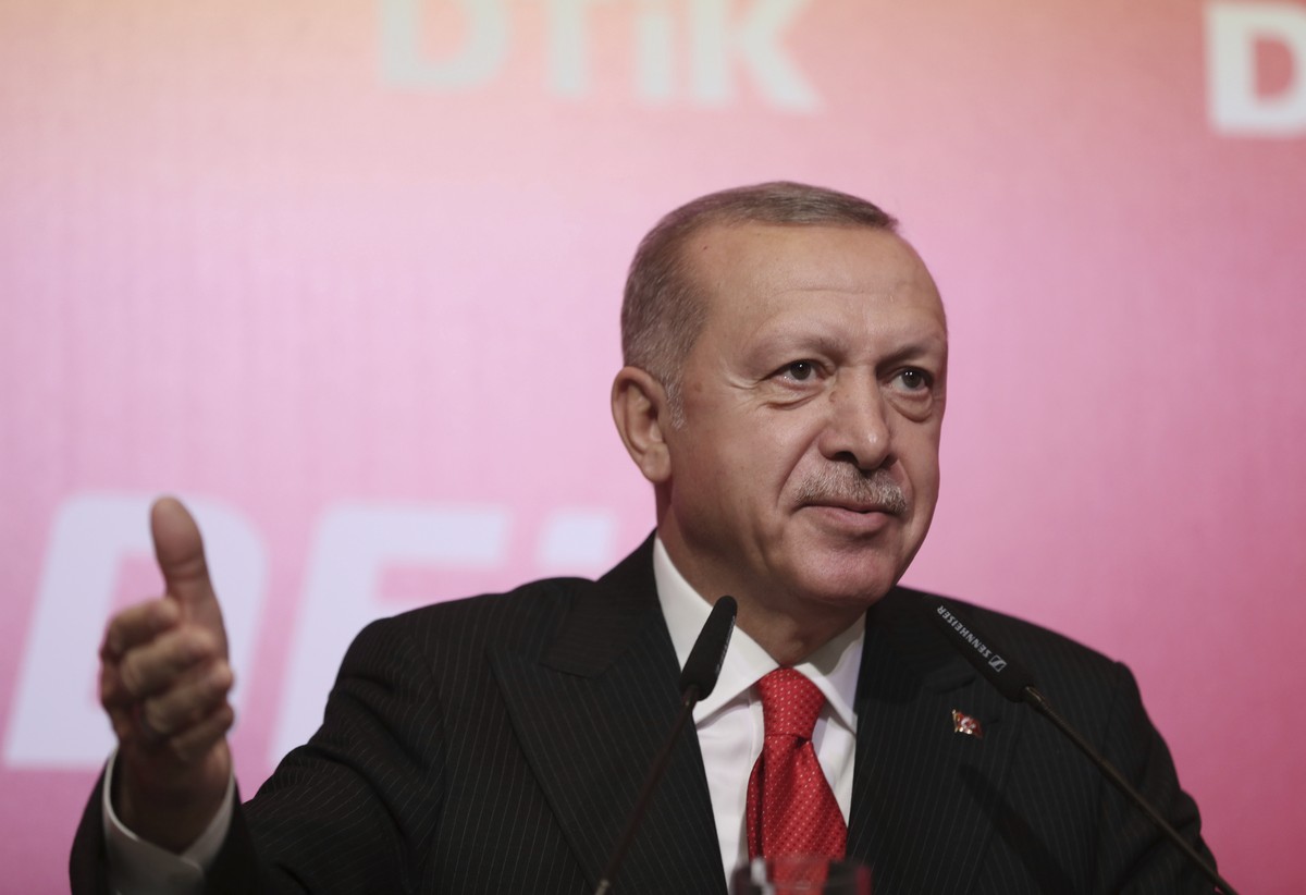 Turkey's President Recep Tayyip Erdogan addresses the World Turkish Business Council meeting, in Baku, Azerbaijan, Monday. Oct. 14, 2019. Erdogan says Turkey's military offensive into northe ...