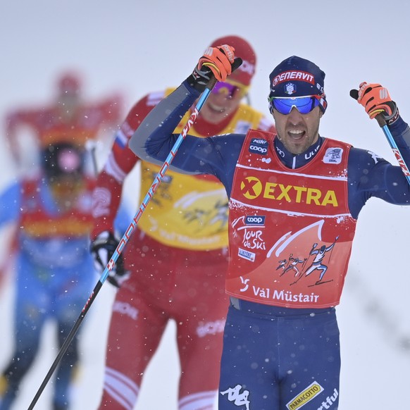 Federico Pellegrino of Italy wins the sprint final of the first stage of the Tour de Ski, in Tschierv, Switzerland, Friday, January 1, 2021. (KEYSTONE/Gian Ehrenzeller).