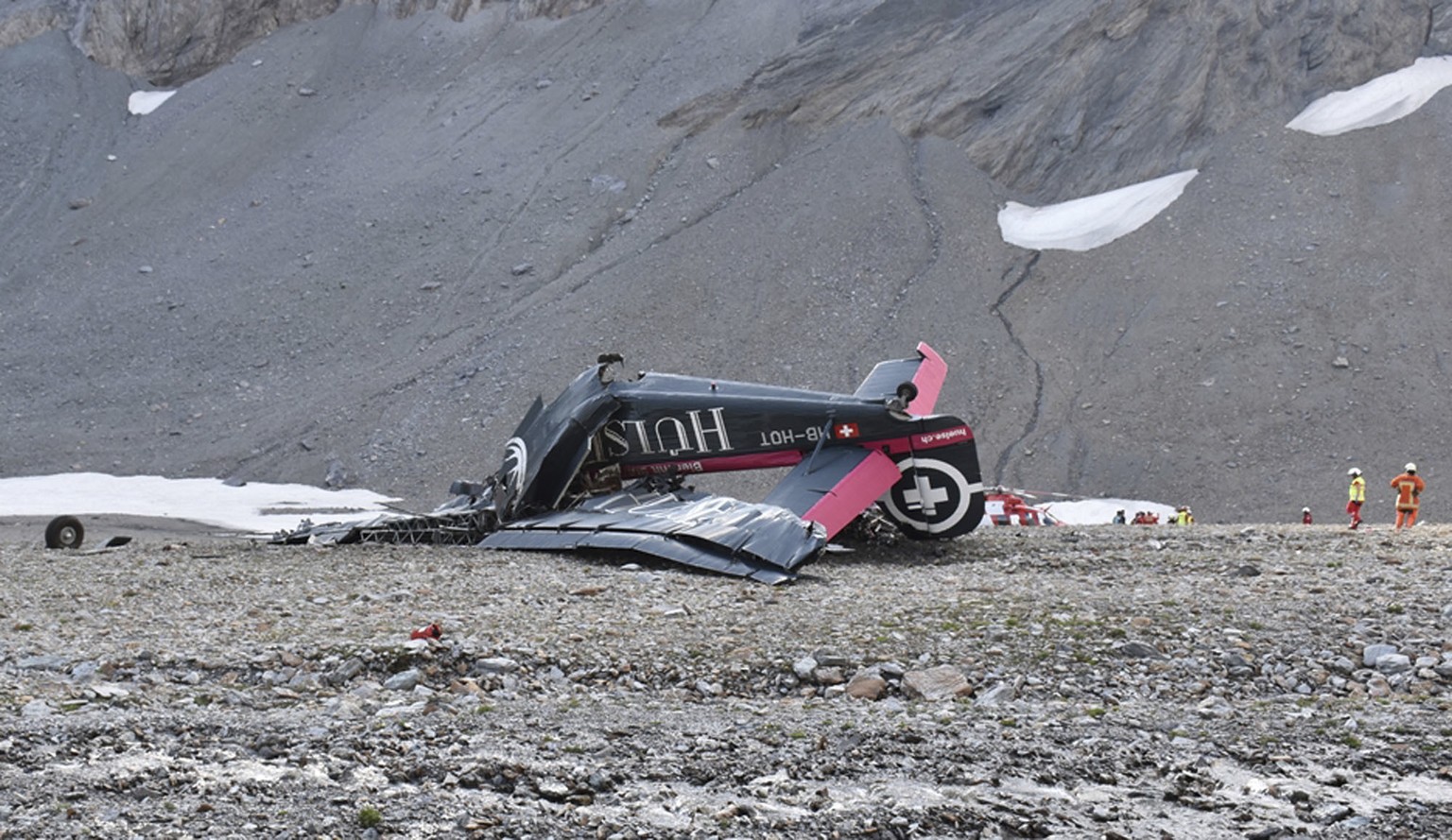 The photo provided by Police Graubuenden shows the wreckage of the old-time propeller plane Ju 52 after it went down went down Saturday Aug, 4 2018 on the Piz Segnas mountain above the Swiss Alpine re ...