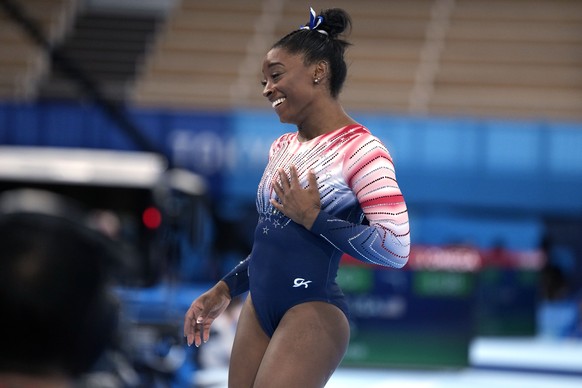Simone Biles, of the United States, finishes on the balance beam during the artistic gymnastics women&#039;s apparatus final at the 2020 Summer Olympics, Tuesday, Aug. 3, 2021, in Tokyo, Japan. (AP Ph ...