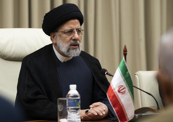 Iran's President Ebrahim Raisi sits across the table from Cuban President Miguel Diaz Canel, alongside their their delegations at Revolution Palace in Havana, Cuba, Thursday, June 15, 2023. (Yami ...