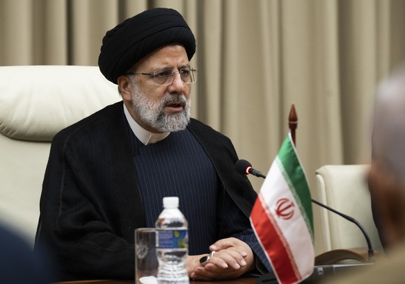 Iran&#039;s President Ebrahim Raisi sits across the table from Cuban President Miguel Diaz Canel, alongside their their delegations at Revolution Palace in Havana, Cuba, Thursday, June 15, 2023. (Yami ...