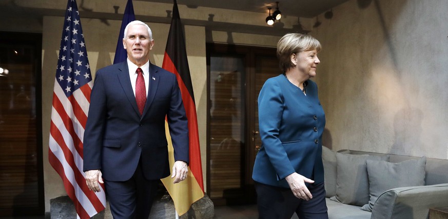 United States Vice President Mike Pence, left, and German Chancellor Angela Merkel meet for bilateral talks during the Munich Security Conference in Munich, Germany, Saturday, Feb. 18, 2017. The annua ...