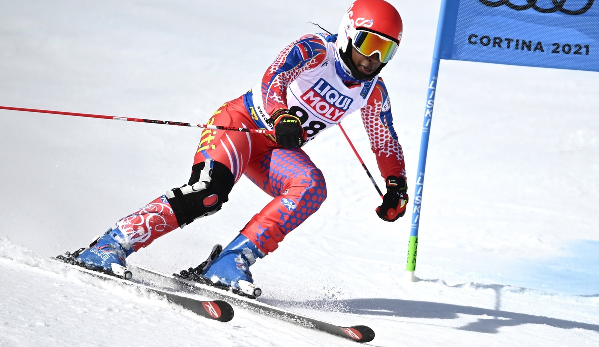 epa09020906 Celine Marti of Haiti cuts a gate during the 1st run of the Women's Giant Slalom race at the Alpine Skiing World Championships in Cortina d'Ampezzo, Italy, 18 February 2021. EPA/ ...