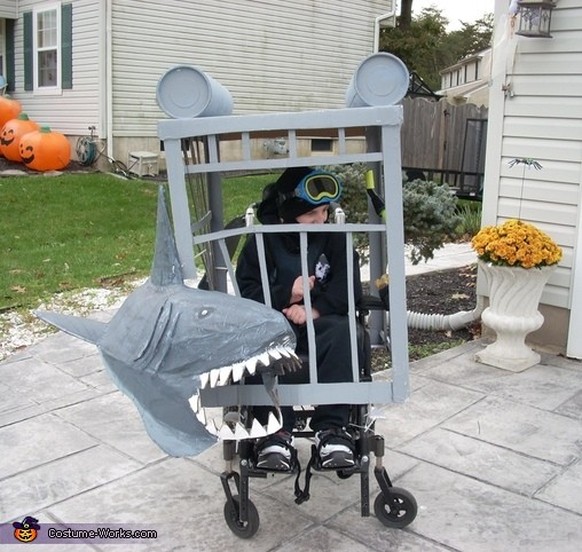 Cool costume for a boy in a wheelchair: The shark cage.