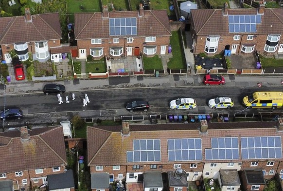 An aerial view of forensic officers near the scene in Kingsheath Avenue, Knotty Ash, where a nine-year-old girl was fatally shot, in Liverpool, England, Tuesday, Aug. 23, 2022. Officers from Merseysid ...