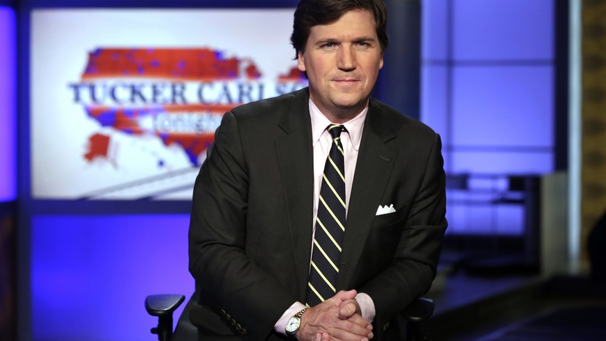 FILE - In this March 2, 2017 file photo, Tucker Carlson, host of &quot;Tucker Carlson Tonight,&quot; poses for photos in a Fox News Channel studio, in New York. Carlson said Wednesday, March 13, 2019, ...