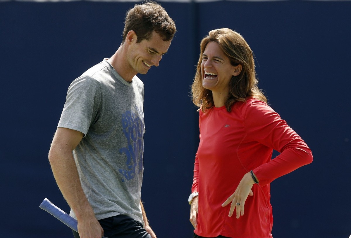 ADVANCE FOR WEEKEND EDITIONS, JUNE 21-22 - FILE - In this June 12, 2014, file photo, Andy Murray, of Britain ,shares a laugh with his new coach Amelie Mauresmo during a training session before his Que ...