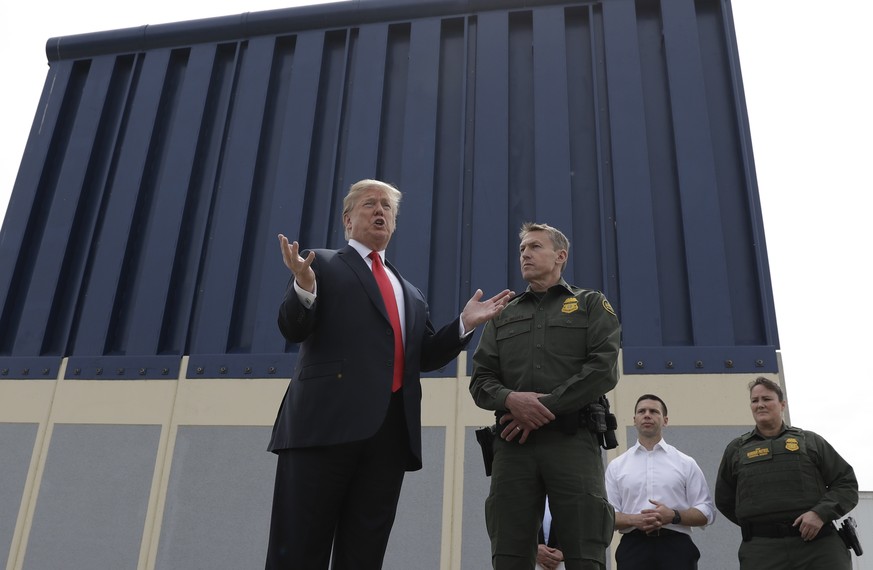 President Donald Trump speaks during a tour as he reviews border wall prototypes, Tuesday, March 13, 2018, in San Diego, as Rodney Scott, the Border Patrol&#039;s San Diego sector chief, listens. (AP  ...