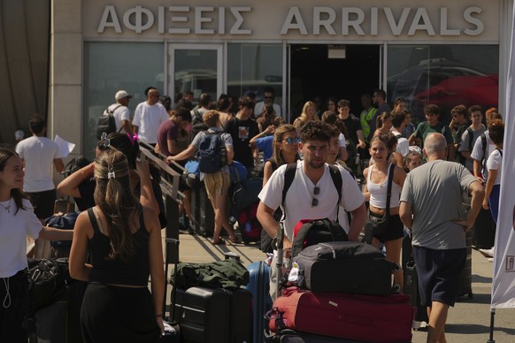 Evacuees from Israel arrive at Cyprus&#039; main port of Limassol aboard the cruise ship Crown Iris, on Saturday, June 21, 2025. (AP Photo/Petros Karadjias)
Cyprus Israel Evacuations