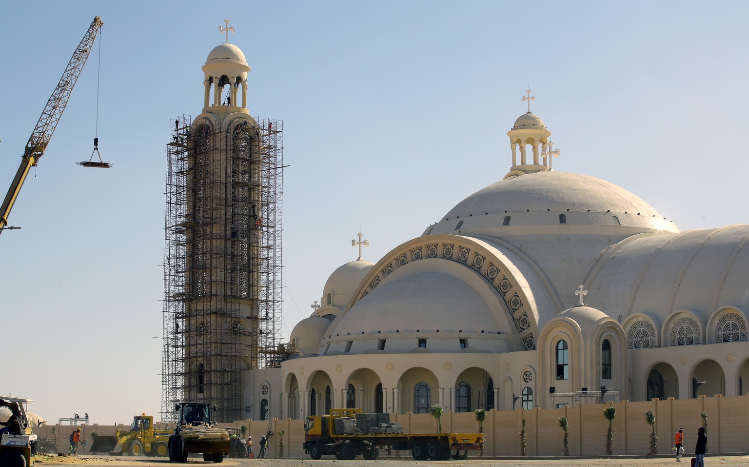 epa07264388 (FILE) - Workers work outside the newly built Coptic Church of the Nativity of Christ Cathedral in the new administrative capital, as yet unnamed, 45 km east of Cairo, Egypt, January 3, 2019 (re...