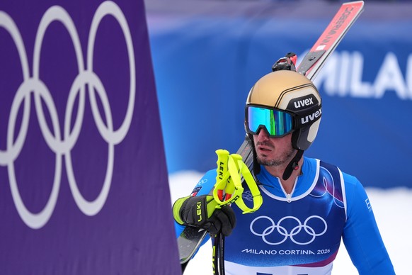 Italy's Dominik Paris at the finish area, during the alpine ski, men's downhill first official training, at the 2026 Winter Olympics, in Bormio, Italy, Wednesday, Feb. 4, 2026. (AP Photo/Pie ...