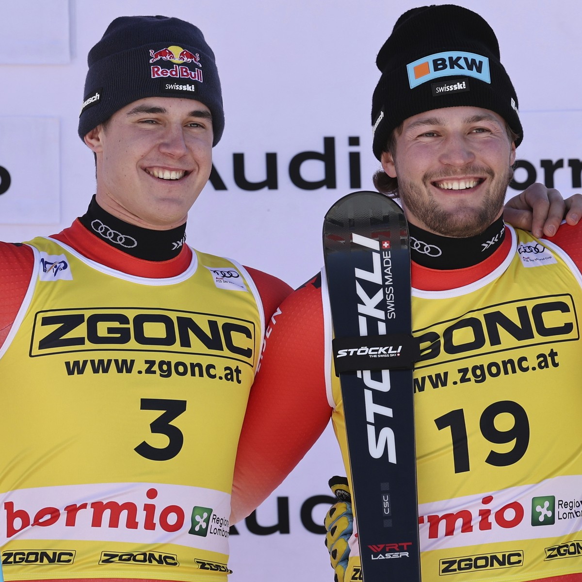 From left, second placed Switzerland's Franjo von Allmen, the winner Switzerland's Alexis Monney and third placed Canada's Cameron Alexander celebrate after an alpine ski, men's Wo ...