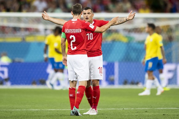 epa06816890 Swiss players Stephan Lichtsteiner (L) and Granit Xhaka (R) react during the FIFA World Cup 2018 group E preliminary round soccer match between Brazil and Switzerland in Rostov-On-Don, Rus ...