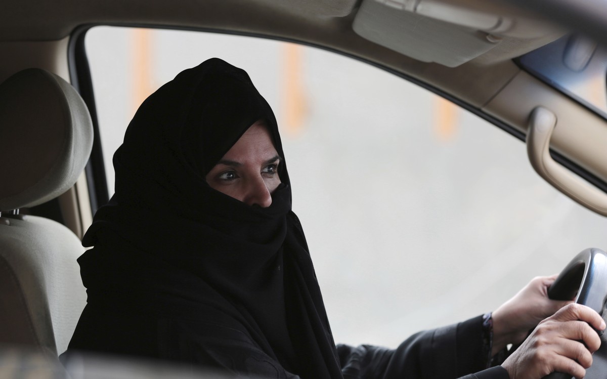 FILE- In this Saturday March 29, 2014 file photo, a woman drives a car on a highway in Riyadh, Saudi Arabia, as part of a campaign to defy Saudi Arabia's ban on women driving. Saudi Arabia author ...