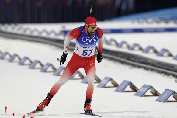 Benjamin Weger of Switzerland approaches the finish line during the men&#039;s 20-kilometer individual race at the 2022 Winter Olympics, Tuesday, Feb. 8, 2022, in Zhangjiakou, China. (AP Photo/Kirsty  ...