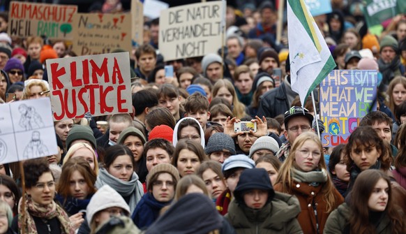 epa10500412 Demonstrators attend the Fridays for Future global Climate Strike rally in Berlin, Germany, 03 March 2023. Fridays for Future is a youth-led climate movement that started in 2018 demanding ...