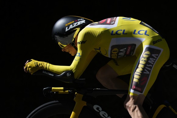 FILE - Denmark&#039;s Jonas Vingegaard, wearing the overall leader&#039;s yellow jersey, competes during the twentieth stage of the Tour de France cycling race, an individual time trial over 40.7 kilo ...