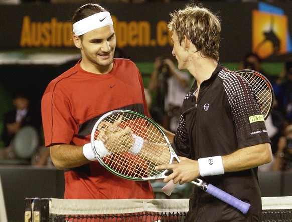 Switzerland&#039;s Roger Federer, left, is congratulated by Spain&#039;s Juan Carlos Ferrero following his semifinal win at the Australian Open in Melbourne, Australia, Friday, Jan. 30, 2004. Federer  ...