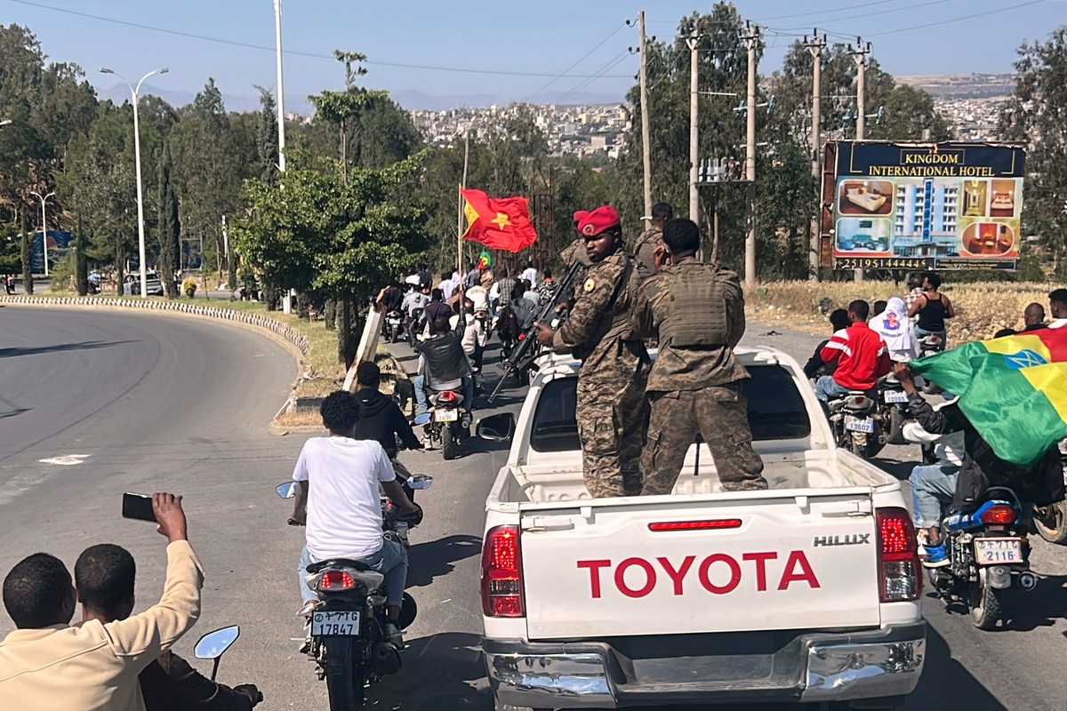 In this photo taken with a smartphone, soldiers participate in a procession welcoming former Tigray leader Getachew Reda in Mekelle, Ethiopia, Sunday, Oct. 11, 2026. (AP Photo/Filmon Equar Hailu)
Ethi ...
