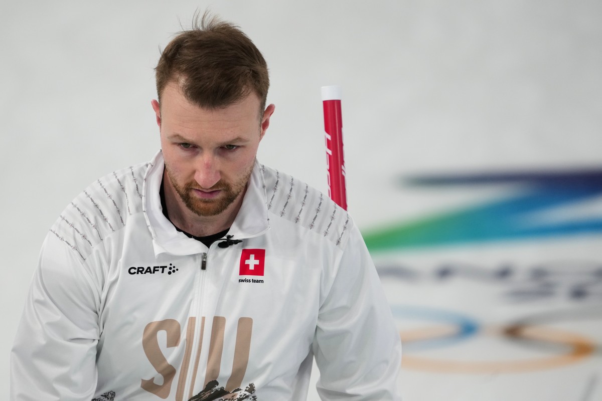 Switzerland's Yannick Schwaller competes during a men's curling bronze medal match between Norway and Switzerland, at the 2026 Winter Olympics, in Cortina d'Ampezzo, Italy, Friday, Feb. ...