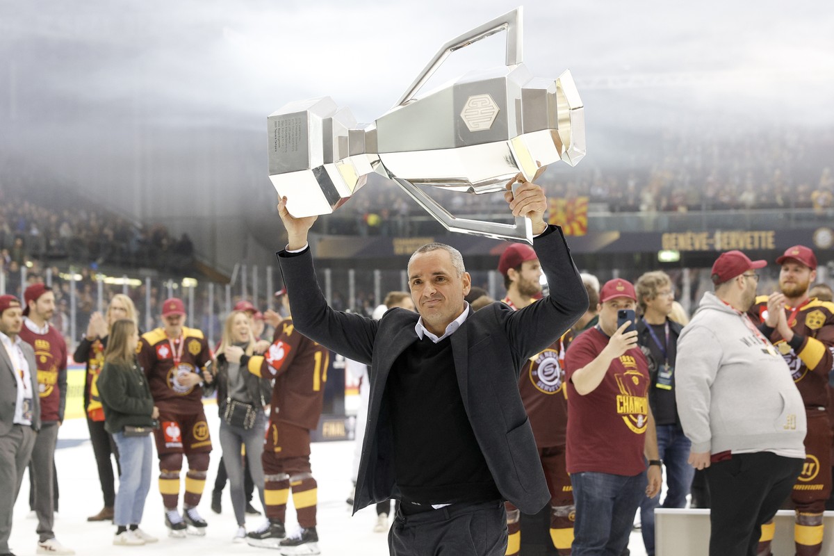 Geneve-Servette's Head coach Jan Cadieux lifts the trophy after winning the Champions Hockey League Final game between Switzerland's Geneve-Servette HC and Sweden's Skelleftea AIK, at t ...