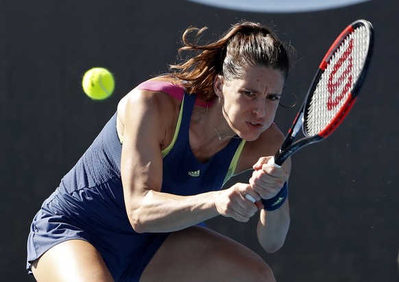 Germany&#039;s Andrea Petkovic makes a backhand return to Petra Kvitova of the Czech Republic during their first round match at the Australian Open tennis championships in Melbourne, Australia, Tuesda ...
