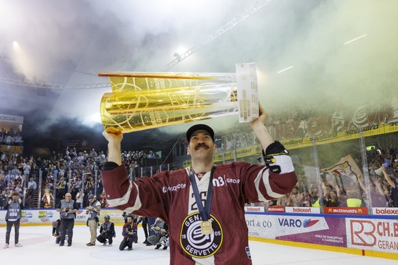 Geneve-Servette&#039;s forward Daniel Winnik celebrates with the trophy of Swiss Champion after winning by 4:1 the seventh and final leg of the ice hockey National League Swiss Championship final play ...