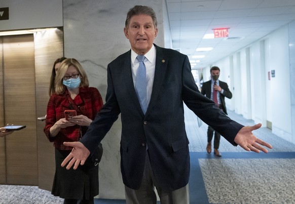 In this Dec. 13, 2021, photo, Sen. Joe Manchin, D-W.Va., leaves his office after speaking with President Joe Biden about his long-stalled domestic agenda, at the Capitol in Washington. Manchin