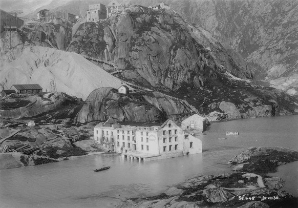 A project claims its victims: the old hospice disappears when it is dammed into the new Grimselsee on August 31, 1930.  https://ba.e-pics.ethz.ch/catalog/ETHBIB.Bildarchiv/r/678