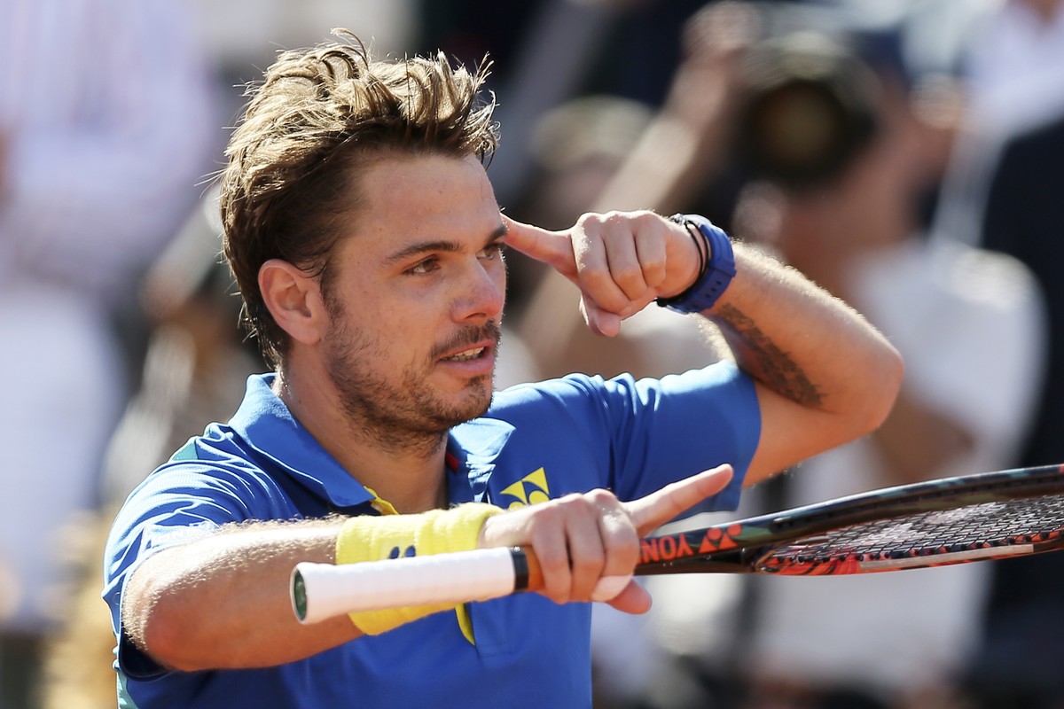 Switzerland's Stan Wawrinka reacts after defeating Britain's Andy Murray during their semifinal match of the French Open tennis tournament at the Roland Garros stadium, Friday, June 9, 2017  ...