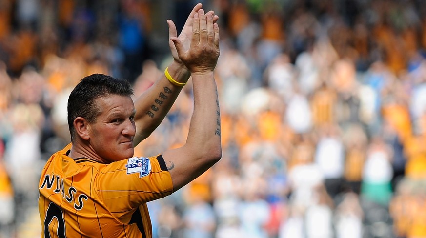 HULL, ENGLAND - AUGUST 09: Dean Windass of Hull City applauds the fans during the Pre Season Friendly between Hull City and Aberdeen at the KC Stadium on August 9, 2009 in Hull, England. (Photo by Lau ...