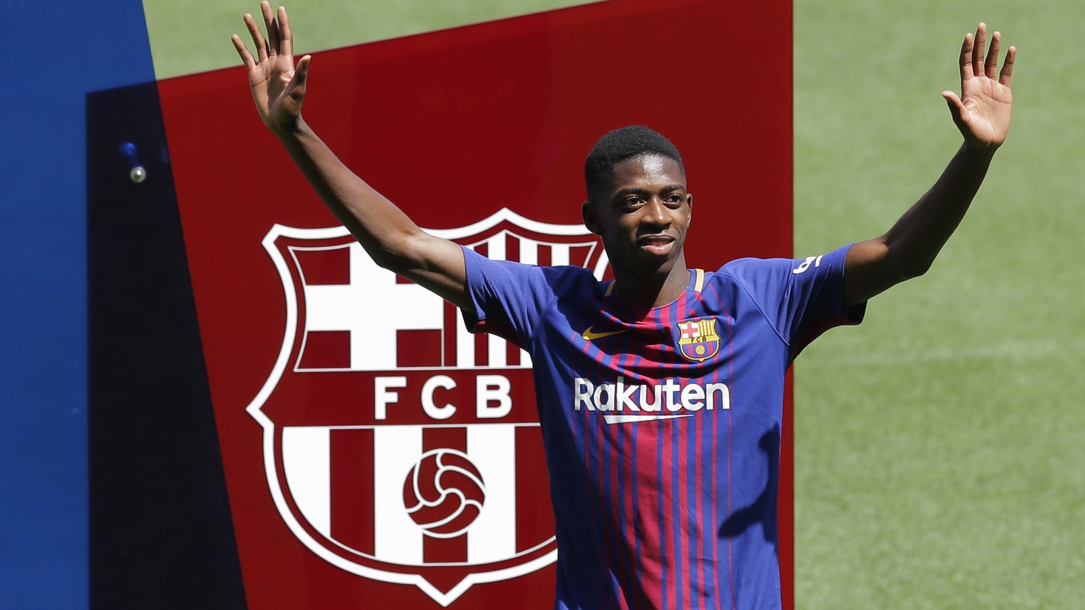 French soccer player Ousmane Dembele gestures during official presentation at the Camp Nou stadium in Barcelona, Spain, Monday, Aug. 28, 2017. Barcelona is shoring up its attack following Neymar's dep ...