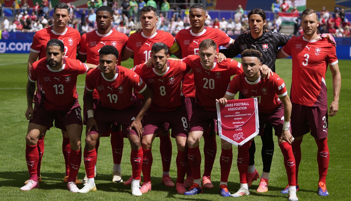 Team Switzerland pose for a photo during a Group A match between Hungary and Switzerland at the Euro 2024 soccer tournament in Cologne, Germany, Saturday, June 15, 2024. (AP Photo/Darko Vojinovic)