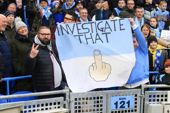 Football - Premier League - Manchester City v Aston Villa 12th February 2023 - Premier League - Manchester City v Aston Villa - Manchester City fans hold up a sign in protest of the charges brought ag ...