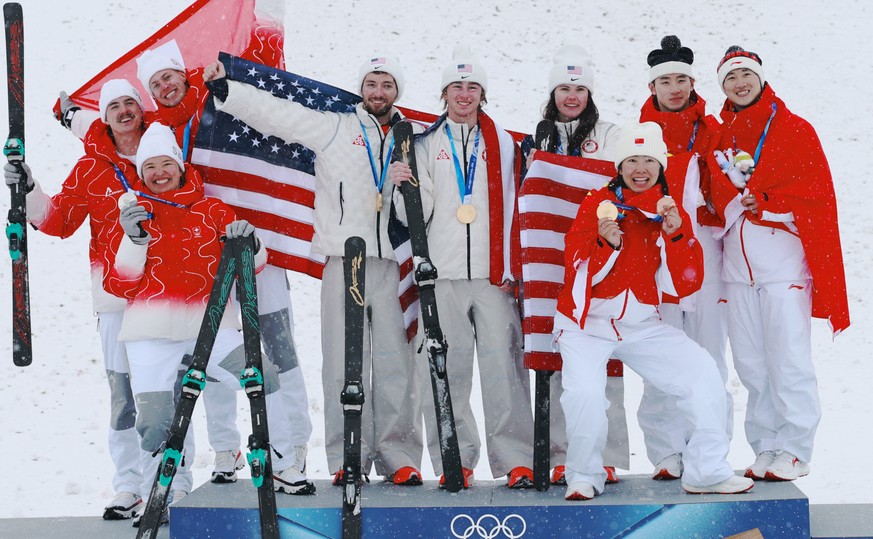epa12764541 (L-R) Silver medalists Noe Roth, Lina Kozomara and Pirmin Werner of Switzerland, Gold medalists Christopher Lillis, Connor Curran and Kaila Kuhn of USA, Bronze medalists Xu Mengtao, Li Tia ...
